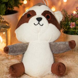 A cute grey raccoon plush toy holding a tiny nut, soft and huggable stuffed animal